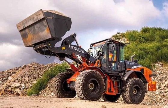 New Hitachi Loader lifting dirt